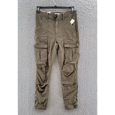 Joie The Park Skinny Cargo Pants Women'S 31 Fatigue Zip Fly With Button Closure Joie The Park Skinny Cargo Pants Women's 31 Fatigue Zip Fly With Button Closure Retail $228.00 These Joie Skinny Cargo Pants Are A Must-Have For Any Stylish Woman's Wardrobe. With A Zip Fly And Button Closure, They Are Easy To Wear And Perfect For Any Occasion. Made From A Blend Of Lyocell, Cotton, And Elastane, They Are Comfortable And Durable. Featuring Cargo Pockets And A Solid Fatigue Color, These Pants Are Utility Mid-rise Bottoms With Button Closure, Utility Cargo Pants With Button Closure, Mid-rise Cargo Pants With Button Closure For Spring, Fitted High Waist Cargo Pants With Button Closure, Fitted High-waisted Cargo Pants With Button Closure, Utility Style Khaki Bottoms With Button Closure, Khaki Utility Bottoms With Button Closure, Fitted High Rise Utility Bottoms, Mid-rise Fitted Utility Pants