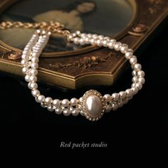 It is a perfect accessory for weddings, formal occasions, or any event where you want to make a statement. This sophisticated choker is designed to showcase your elegance and charm. Features: Material: Artificial pearls and alloy Chain style: Round pearl chain Length: 33cm + 11cm adjustable Weight: 38g Multi-layered with a pendant Pendant Material: Alloy Circumference: 21cm (inclusive) - 50cm (inclusive) With its vintage pearl design and delicate craftsmanship, this unique choker exudes a timele Luxury Vintage Necklace Collection, Luxury Temple Jewelry Wedding Choker, Luxury Victorian Chain Necklace As Gift, Luxury Elegant Pearl Necklace For Layering, Luxury Victorian Antique Finish Necklace, Luxury Jewelry With Historical Baroque Design, Luxury Antique Pearl Chain Necklaces, Luxury White Elegant Kundan Necklace, Luxury Traditional Necklaces With Historical Design