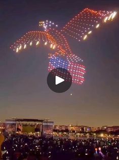 an airplane is flying in the sky with lights on it