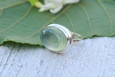 Natural  Prehnite ring, Sterling Silver ring, cocktail ring, alternative engagement ring, Prehnite jewelry, Valentine's day jewelry, silver jewelleryI T E M  D E S C R I P T I O N: Gemstone Size= 12 x 16 mm All jewelry is Handmade and is Nickel/Lead FREE. so you don't have to worry about any allergies.C U S T O M E R  S U P P O R T :We are available 24/7 to answer all your queries. We create all our products with utmost love and care. Still, if you find any flaws in it, please don't hesitate to Green Moonstone Birthstone Ring Gift, Green Moonstone Birthstone Ring As A Gift, Green Moonstone Ring As A Birthstone Gift, Handmade Elegant Green Moonstone Ring, Elegant Handmade Green Moonstone Ring, Prehnite Gemstone Ring Jewelry, Green Cabochon Moonstone Ring Gift, Prehnite Ring Jewelry Gift, Green Sterling Silver Moonstone Ring Gift