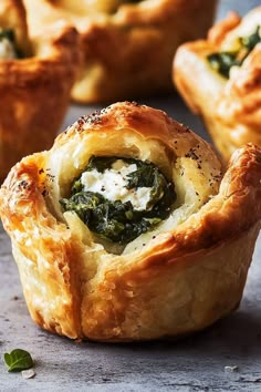 spinach and cheese pastry cups on a table