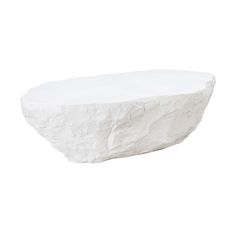 a large white rock sitting on top of a table