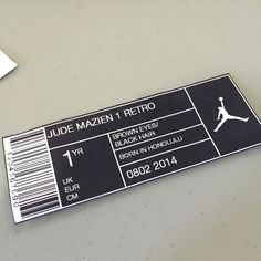 a black and white ticket sitting on top of a table