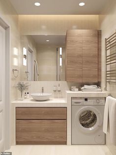 a washer and dryer in a bathroom with wooden cabinets, white counter tops and beige flooring