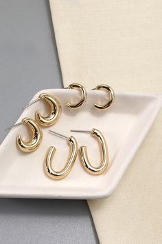 An elegant charming unique must have trending pair of earrings that is made into a mini trio hoop earrings set design. .Perfect for casual events with on your dresses or denim shorts.DIMENSION length: .75" - .5"width: .5" earring back: postmetal finish: Gold Platingproduct: Lead & Nickel Compliantanti-tarnish: Double E-coating Double Earrings Nordstrom, Cute Adjustable Hoop Earrings On A Budget, Trendy Hoop Earrings For Spring, Cheap Modern Hypoallergenic Hoop Earrings, Cheap Spring Hoop Earrings, Cute Adjustable Hoop Earrings At Cheap Price, Cheap Small Hoop Earrings As Gift, Post Metal, Earring Sets