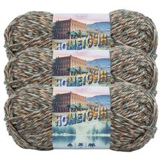 two skeins of yarn with the words home town written on them in different colors