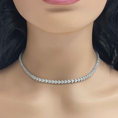 A classic and elegant everyday or occasional wear the Directions Diamond Tennis Necklace is a timeless and versatile piece of jewelry. All our necklaces have two locks for added security. Total Diamond Weight: 9.00 ct Diamond Color: H - I Diamond Clarity: SI - I (Slightly Included - Included) Metal: 14K White Gold Metal Wt: 21.30 gms Setting: Prong Set Length: 16 Inches (40.6 cm) Classic Tennis Choker Necklace For Formal Occasions, Classic Formal Tennis Choker Necklace, Elegant Formal Tennis Necklace With Clavicle Chain, Classic Formal Diamond Choker Necklace, Diamond White Solitaire Single Strand Necklace, Silver Tennis Necklace With Clavicle Chain For Wedding, Classic White Gold Choker Necklace, Formal Single Strand Diamond Chain Necklace, Classic Diamond Necklace With 17 Jewels