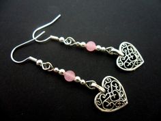 This a pair of pretty tibetan silver dangly heart earrings. Made with 4mm pink jade beads. Measure approx. 4cm from top of hook to bottom of earring. Freshly made by me and unworn. Thanks for looking!! Elegant Pink Heart Metal Earrings, Silver Heart Beads Metal Earrings, Silver Metal Earrings With Heart Beads, Pink Heart Beads Drop Earrings, Heart Beads Metal Earrings For Gift, Metal Heart Beads Earrings For Gifts, Metal Heart Beaded Earrings For Gifts, Pink Heart Beads Dangle Jewelry, Gift Metal Heart Earrings With Heart Beads