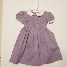 Adorable Purple Dress With Collar, Belt Ties In Back. 3 Buttons. Brand New With Tag. *Has A Small Pull In Front Bottom* Fitted Purple Dress For Dress-up, Purple Short Sleeve Dress For Dress-up Events, Purple Short Sleeve Dress Up Dresses, Purple Fitted Dress With Smocked Bodice, Fitted Purple Dress With Smocked Bodice, Fitted Purple Dresses With Smocked Bodice, Cute Fitted Purple Dress, Cute Fitted Purple Dresses, Cute Purple Short Sleeve Dress