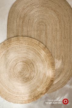 two woven placemats sitting on top of each other in front of a white background