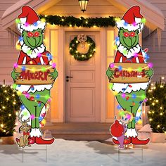 the grinch christmas yard decorations are in front of a house with lights and wreaths