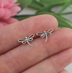 Dragonfly Earrings.  These sterling silver dragonfly stud earrings are made of solid 925 sterling silver casted dragonfly charms soldered onto .925 sterling silver posts with sterling silver backings.  Earrings measure approx. 7.5mm.  As spirit animal, the dragonfly is connected to the symbolism of change and light. When the dragonfly appears nearby, it may remind you to bring a bit more lightness and joy into your life. Minimalist and dainty, a perfect every day earring. 😊 COMPLIMENTARY GIFT N Silver Dragonfly Earrings For Gift, Silver Dragonfly Earrings Perfect For Gifts, Hypoallergenic Dragonfly Earrings As A Gift, Hypoallergenic Dragonfly Earrings For Gift, Dragonfly Gifts, Dragonfly Jewelry, Dragonfly Charm, Dragonfly Earrings, Earrings Stud