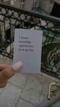 someone holding up a piece of paper that says i attract incredible opponents in to my life