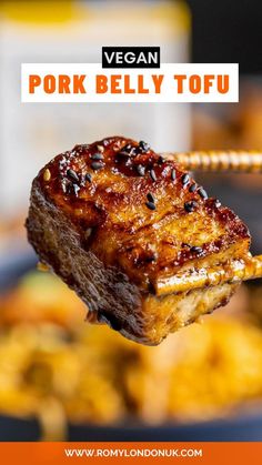 a piece of meat is being held by a fork with the words vegan pork belly tofu on it