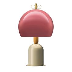 a pink lamp sitting on top of a white table