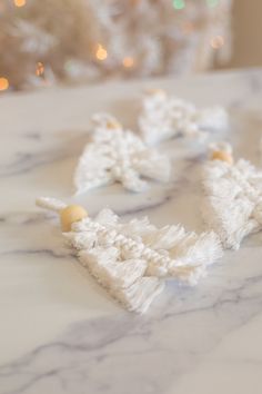 white crocheted snowflakes on a marble table