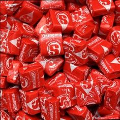 a pile of red and white candies with the word campbell's on them