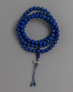 7A Natural Lapis Lazuli Mala Beads About our mala beads These stunning 7A natural lapis lazuli stones are fashioned into the Lapis Lazuli Mala Beads, which exude a timeless beauty. Beads are prized for their rich blue colors and their spiritual significance; each one is handpicked to maintain its inherent beauty and energy. The 5mm beads' polished, smooth surface provides a calming tactile experience that leads practitioners through their meditation journey with grace and ease.The vajra, which i Spiritual Lapis Lazuli Beaded Necklaces, Spiritual Lapis Lazuli Round Beads, Lapis Lazuli Beads With Natural Stones, Round Lapis Lazuli Beads With Natural Stones, Blue Lapis Lazuli Gemstone Beads, Holistic Blue Beaded Bracelets, Blue Hand Knotted Jewelry For Gift, Blue Hand-knotted Jewelry For Gift, Blue Hand Knotted Round Bead Necklaces