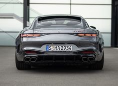 the rear end of a silver sports car