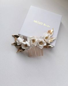 Elsa's hair comb will beautifully finish any soft romantic up do or make a statement by placing it at the back of your hair up or frame your soft waves by wearing on the side. Made with white handmade flowers available with gold or silver details.  Sent beautifully packaged in Medze Bride gift box. As each Elsa hair comb is made to order specially for you I cannot accept refunds/exchanges. But if you have any problems with your order please email me and I'll be happy to help you. Bridal Floral Hair, Floral Hairpiece, Elsa Hair, Floral Hair Comb, Hair Accessories Wedding, Hair Comb Bridal, Floral Hair Combs, Comb Hair, Ocean Wallpaper