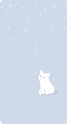 a white cat is sitting in the snow