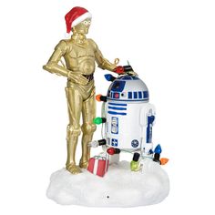 a star wars christmas ornament with a robot and r2d2 figure