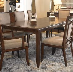 a dining room table with chairs around it