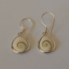 Handmade 925 Sterling silver and shiva eye shell earring.  Measurements: 20mm.x15mm.wide. Handmade Sterling Silver Shell, Shiva Eye, Shell Earrings, Sterling Silber, Shiva, Jewelry Earrings Dangle, Shells, Dangle Earrings, Jewelry Earrings