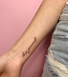 a woman's arm with a tattoo that reads, love yourself on the wrist