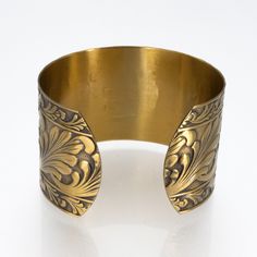 Antiqued Brass Cuff, Brass Cuff Scroll Design, Lacquered Brass Cuff Bracelet, Brass Cuff Bracelet □ Antiqued Brass Cuff - 1 Piece □ Size: 1.5 inches wide - Scroll design □ Nickel & Lead-free USA brass □ Adjustable Stunning detail on these beautiful embossed cuffs. These are very sturdy but adjustable The tooling dates back to the 1940s and cannot be duplicated in today's market. Unlike my raw brass cuff collection, these special pieces are hand antiqued, hand polished and have a baked lacque Luxury Antique Handmade Cuff Bracelet, Luxury Adjustable Ornate Cuff Bracelet, Cheap Adjustable Brass Cuff Bracelet, Brass Cuff Bracelet, Brass Cuff, Dragonfly Charm, Brass Bells, Vintage Bell, Scroll Design