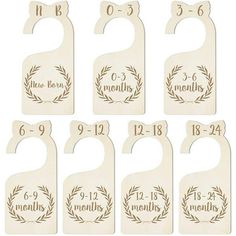 six wooden door hangers with names and numbers on them, each one has a wreath