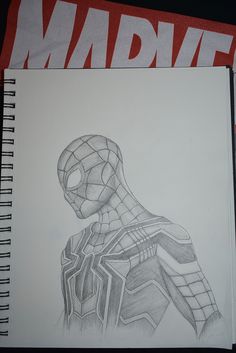 a drawing of a spider - man is shown on a piece of paper