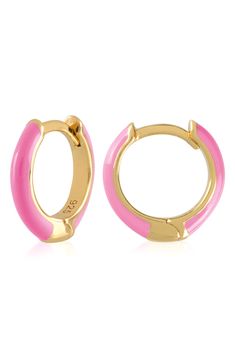 Easy-to-wear hoop earrings will add significant polish to even your most casual ensembles. 1/2" drop; 1/8" width Hinge with snap-post closure Sterling silver with goldtone plate/enamel Imported Pink Enamel Hoop Jewelry, Enamel Huggie Earrings Perfect For Gifts, Trendy Enamel Huggie Earrings, Trendy Enamel Earrings For Everyday, Trendy Pink Huggie Earrings, Small Hoop Enamel Earrings, Pink Enamel Hoop Earrings, Nickel-free Pink Huggie Hoop Earrings, Pink Nickel-free Huggie Hoop Earrings