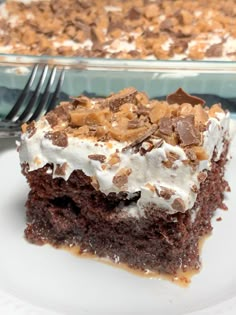 a close up of a piece of cake on a plate with a fork in it