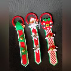 three pairs of scissors decorated with christmas decorations