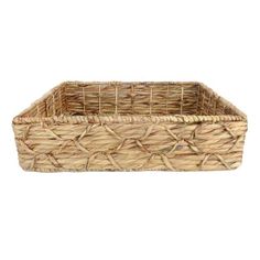 a large rectangular basket with handles on the bottom is made out of straw and has two sides