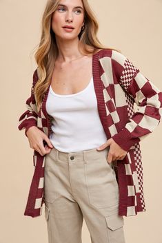 This Checked Out Cardigan is the perfect choice for fashionable and functional layering! Made from high quality and durable materials, it features a trendy check pattern with ribbed trim for extra style. This boyfriend fit cardigan is a must-have for any wardrobe. 83% Viscose 17% Nylon Ribbed Trim Finish Loose Fit Contrasting Grid sizes Exposed Seam Detail on Drop Shoulder Seam SIZE GUIDE & MEASUREMENTS: Model is 5'4", wears a size 3/5 and is modeling the small. More info here. Small 2-4 Medium 6-8 Large 10-12 X-Large 14-16 SIZE BUST SLEEVE LENGTH Small 47" 19" 29" Medium 51" 19" 29" Large 54" 20" 29" X-Large 56" 22" 29" **measurements may vary by 1/2" Ships from Utah within 1-3 business days of order being placed. Limited stock based on vendor availability. Plaid Cotton Sweater For Fall, Plaid Sweater For Fall, Winter Plaid Cotton Cardigan, Plaid Cotton Cardigan For Spring, Fitted Plaid Cardigan For Fall, Casual Plaid Cardigan For Layering, Fitted Cardigan, Boyfriend Fit, Check Pattern