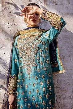 Premium Embroidered Pakistani Wedding Dress in Blue is a Traditional masterpiece fully emblazoned with Embroidery and Gold-copper work. Fast shipping. Gold Jamawar Dress With Resham Embroidery, Gold Embroidered Raw Silk Dress, Blue Embroidered Semi-stitched Dress For Wedding, Blue Semi-stitched Dress With Intricate Embroidery, Gold Jamawar Dress With Zari Work, Blue Embroidered Dress With Dabka Work For Wedding, Blue Embroidered Dress For Wedding With Intricate Embroidery, Blue Embroidered Dress For Wedding, Blue Embroidered Wedding Dress With Intricate Embroidery