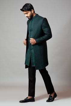 Emerald green straight-cut sherwani with honeycomb motif all-over cutdana work. Comes with short kurta and slim fit contrast trousers.
Component: 3
Embroidered
Neckline: Mandarin Collar
Sleeve Length: Sherwani: Full
Fabric: Sherwani: Suiting; Kurta: Linen; Trousers: Suiting
Color: Green
Concealed placket kurta
Seam pockets - Aza Fashions Green Sherwani, Black Slim Fit Trousers, Short Kurta, Green Trousers, Indian Wedding Wear, Western Look, Embroidered Neckline, Black Trousers, Linen Trousers