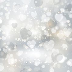 blurry background with hearts and bokets in shades of grey, white and gold