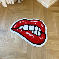 the rug is shaped like a red lips mouth