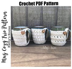 three crocheted coffee mugs with hearts on them