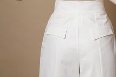 White high-waisted pleated palazzo pants IPANTS with back vents. With this model, you can create an incredibly stylish bridal look or a comfy everyday city look. They are perfect with almost everything, cropped t-shirt to the blouse, cardigans, flat shoes, sneakers or heels you'll find them so easy to wear. * Two side and back pockets * Zip on the middle STANDARD SIZES Sizes available: XS, S, M, L, XL. The model is wearing size S. Size XS waist- around 26,4''/ 67 cm hips- around 37''/ 94 cm Tota Elegant White Wide Leg Pants With Belt Loops, High Waist Bottoms For Wedding, Chic High Waist Pants For Wedding, Elegant High-waist Pants For Wedding, Elegant High Waist Pants For Wedding, Elegant Ankle-length Pants For Wedding, Chic Trousers For Wedding, Chic Wedding Trousers, Chic High-waisted Pants For Wedding