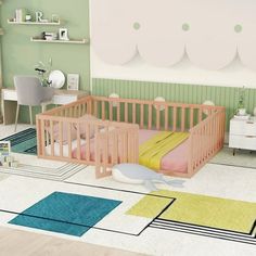 a baby's room with green walls and pastel colors on the floor, including a pink crib