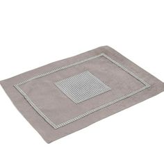 a gray blanket with white trim on the edges and a square design in the middle