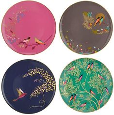 four plates with birds painted on them in different colors and designs, one is pink, the other is blue