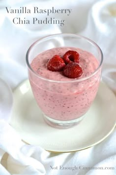 a small glass bowl filled with raspberry chia pudding on top of a white plate