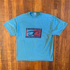 Dope Washington DC T-shirt from the '90s. Big spellout and graphic on front. Beautiful cyan color. Amazing condition. Tagged an XXL but fits like an XL.  Brand: Delta Size: XL Color: Blue, Multi Condition: Excellent 90s Style Blue T-shirt With Text Print, 90s Blue Logo Print T-shirt, 90s Blue Short Sleeve T-shirt, 90s Style Blue Short Sleeve T-shirt, 90s Blue T-shirt With Text Print, Fsu Shirts, Vintage Washington Dc, Pittsburgh Steelers Hats, Cyan Color