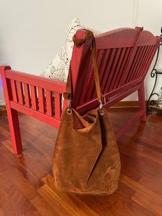 The hobo style of this Hobo Bag Leather offers a relaxed, soft look, while its shape ensures it's roomy enough to fit all your essentials.  The Suede Hobo Bag is equipped with a long shoulder strap. You can tie a knot at the shoulder strap, this allows you to wear it over the shoulder or crossbody, providing a comfortable, hands-free option. This Brown Hobo Bag is crafted with the finest quality Italian suede known for its softness, durability and unique texture. Suede is made from the underside Brown Rectangular Hobo Bag With Removable Pouch, Everyday Pouch Baguette Bag With Handles, Hobo Shoulder Bag With Adjustable Strap, Modern Hobo Bucket Bag For Daily Use, On-the-go Hobo Bag With Adjustable Strap, Daily Use Hobo Bag With Detachable Handle, Brown Hobo Shoulder Bag For On-the-go, Brown Hobo Bag With Detachable Handle, Brown Hobo Bag For On-the-go