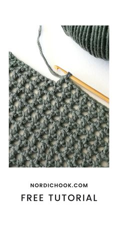 the crochet pattern is shown with yarn and knitting needles on top of it